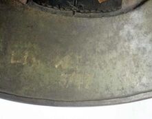German helmet with owners name and unit